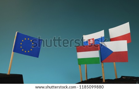 A europe union on one side and vysegrad four on second side. Who will win? Blue background Royalty-Free Stock Photo #1185099880