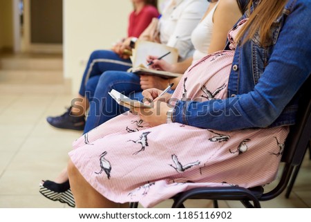 A pregnant woman in courses for expectant mothers. Royalty-Free Stock Photo #1185116902