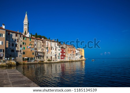 Fantastic spring sunset of Rovinj town, Croatian fishing port on the west coast of the Istrian peninsula. Colorful evening seascape of Adriatic Sea. Traveling concept background. Morning in the town.
