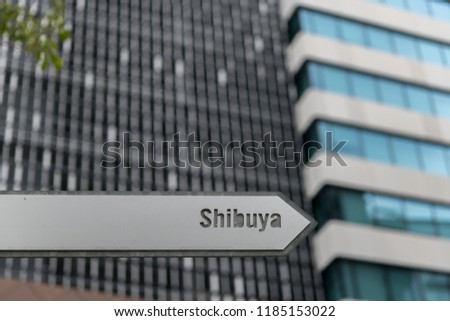 Sign Shibuya, Tokyo. Window of office buildings in the background.