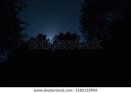  Scenic night landscape of dark blue sky with moon