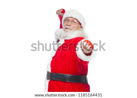 Christmas. Santa Claus with red bandages wound on his hands for boxing imitates kicks. Kickboxing, karate, boxing. Isolated on white background.