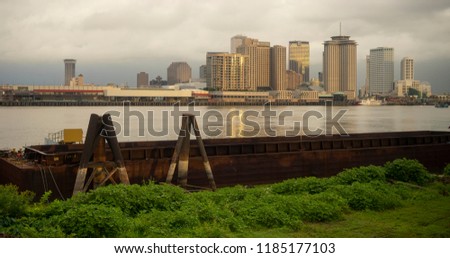 Cloudy skies start to clear after a storm making a dark background behind the buildings of New Orleans Louisiana 