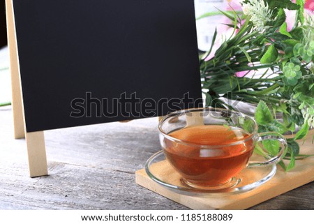 Cup of Green Tea on Wood