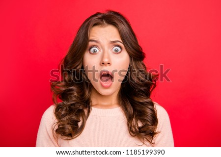 Total sale and huge discount concept. Close up portrait of wow, wtf face woman with big eyes and wide open mouth and modern hairdo isolated on vivid red background Royalty-Free Stock Photo #1185199390