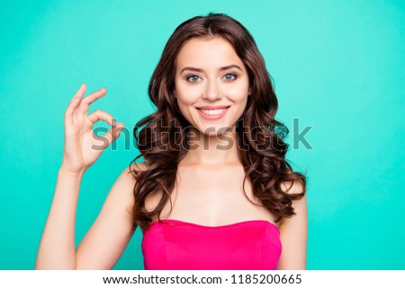 Close-up portrait of nice cheerful positive attractive lovely adorable charming delighted satisfied wavy-haired girl in vivid fuchsia top, showing ok-sign, isolated on green turquoise background