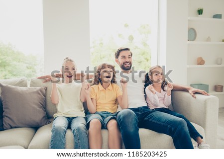Relax, rest, carefree, careless concept. Photo of single father with adopted kids pre-teen preteen with raised hands up sit on soft cozy, comfort couch in bright lovely room