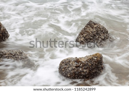 Rock and wave at the beach 