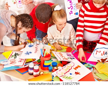 Child painting at art school. Education.