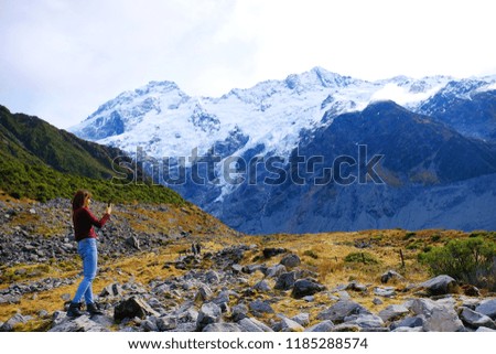 Tourist walking and take picture front of snow mountain at view point to Aroki mountain.
