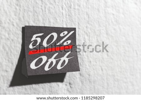 Black Friday shopping sale on post it reminder paper on wall.