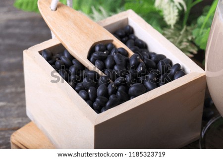 Black Beans on Wood Background