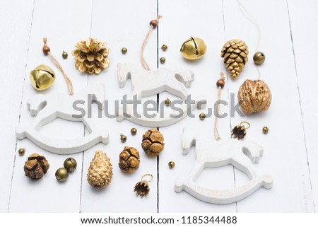rocking horse Christmas decorations on white wooden table background