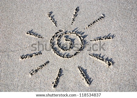 sun outline on the wet sand - summer holidays in hot country concept
