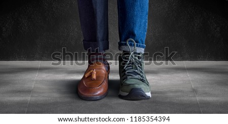Work Life Balance Concept. Low Section of a Man Standing with Half of Working Shoes and Casual Traveling Shoes Royalty-Free Stock Photo #1185354394