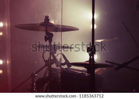Live music background photo, rock band drum set. Vintage warm toned close up photo, soft selective focus