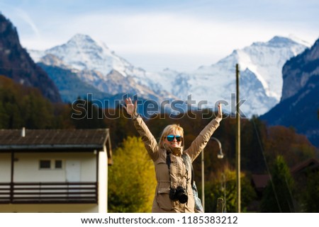 Beautiful girl photographer taking photos in Switzerland