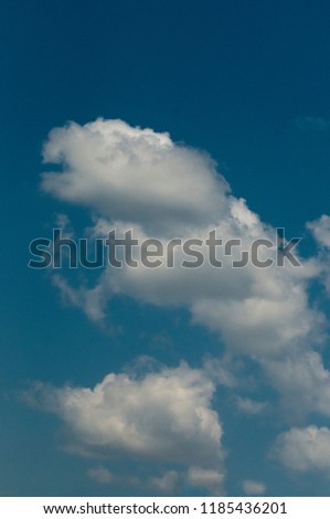 White forms and symbolic clouds on a blue sky. Prototype theory, Apofanie, Pareidolia,