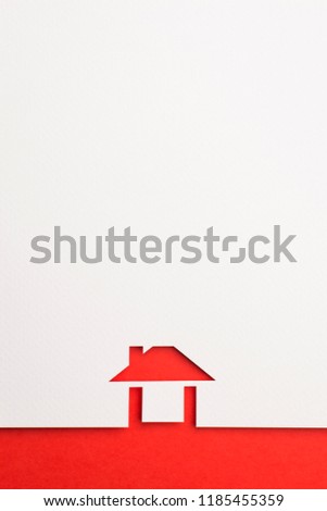 white paper cutout in easy house shape with border background by red paper, for home and insurance conceptual.