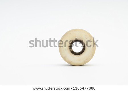 Close up of a skateboard wheel on white background. Complete skateboard parts