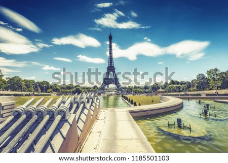 Trocadero Fountains and the Eiffel tower on a summer day with dramatic sky. Travel background.