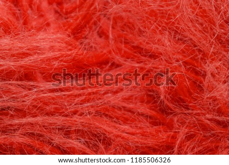 Red fluffy wool texture, animal wool background, painted fur texture closeup