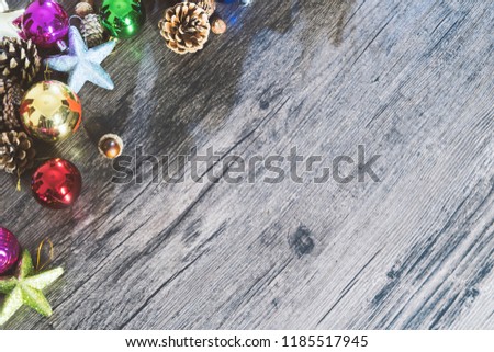 The background of the black cedar and the border of the light wreath, the wooden background of the Christmas atmosphere of art design.