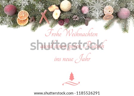 Christmas fir branches isolated against white background with the text Merry Christmas and a Happy New Year written in German