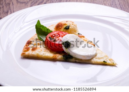 Pizza Caprese with basil and mozarella