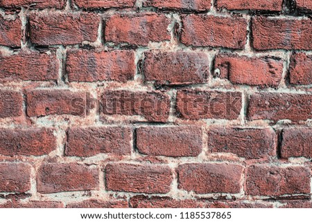 texture or background red masonry stone, pattern, background or wallpaper of brick, plain old stone wall, Fragment of a wall from a chipped stone