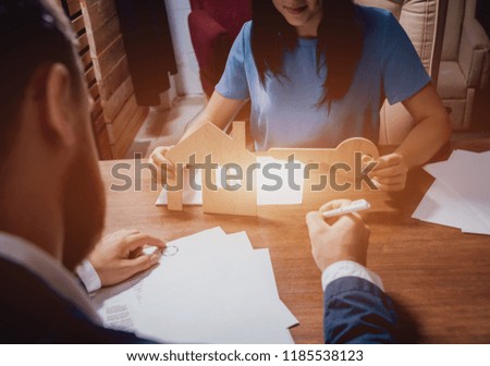 Man sign a home insurance policy on home loans. Estate agent with customer before contract signature. Real Estate concept. Insurance agency concept