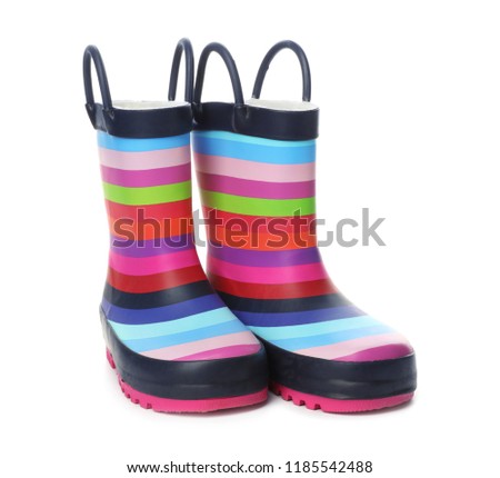 Colorful children's rubber boots on white background