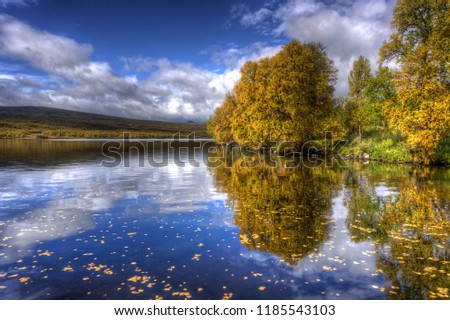 Swedish Autumn over a mountain lake 
 