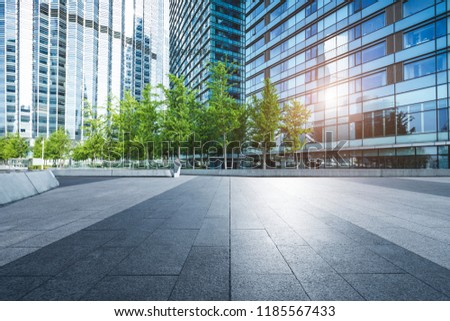Modern commercial buildings and urban green landscape belts. Royalty-Free Stock Photo #1185567433