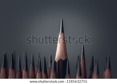 One pencil standing out from the group of other pencil.Leadership and growth in business concept.
 Royalty-Free Stock Photo #1185632755