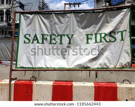 SAFETY FIRST label on the street for traffic safety signs at the bridge construction area.