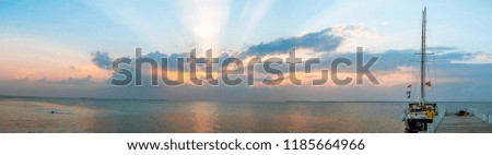 Panoramic sunset with sun rays in Belize