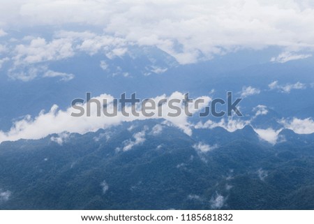 Top  view  mountainscape cover by white cloud after rain in Laos took photo from airplane window while travel from  Vientiane to chiangkhuan , Laos