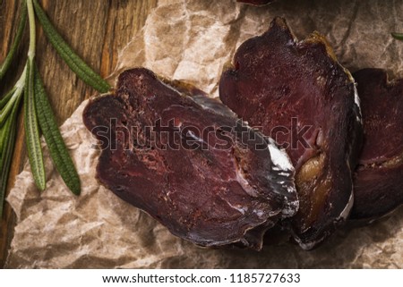 Sliced slices of smoked sausage close-up