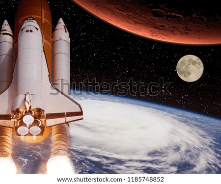 Rocket flies from earth to Mars. Moon in the distance. The elements of this image furnished by NASA.
