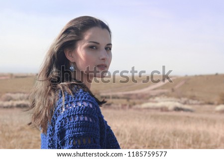 Lonely Young Woman portrait. Long Hair blowing in the wind.