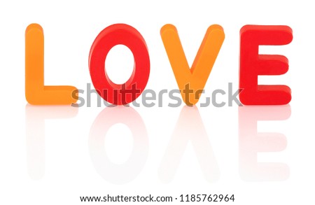 Orange and Red Love sign isolated on white background with shadow reflection. LOVE title in plastic letters on white backdrop.