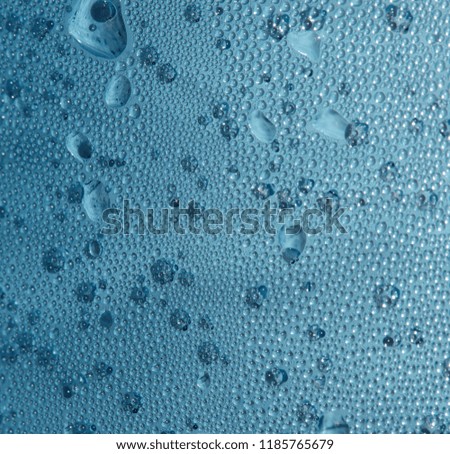 Texture of abstract water drops on a blue background