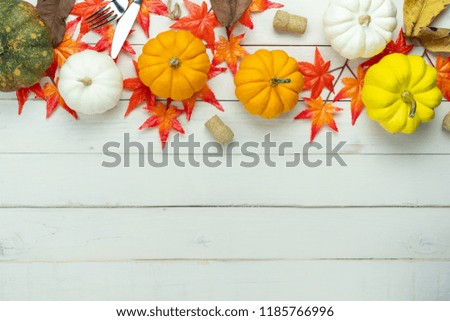 Table top view aerial image of decoration Happy Halloween or Thanksgiving day background concept.Flat lay accessory object to party the pumpkin & maple leaf on white wooden.Space for creative design.