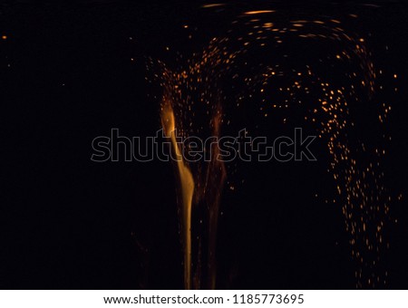 sparks of fire on a black background at night