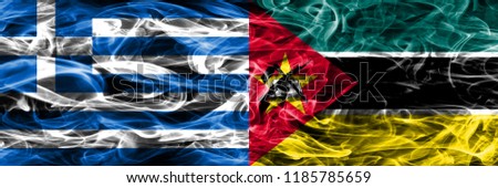 Greece vs Mozambique smoke flags placed side by side. Thick colored silky smoke flags of Greek and Mozambique