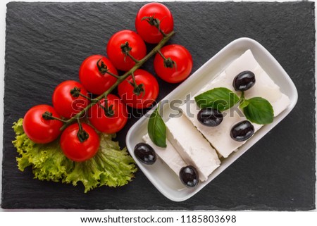 A piece of feta cheese on a white background