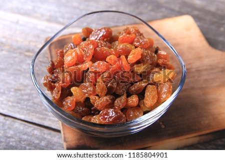 Golden Raisins in a Glass Bowl