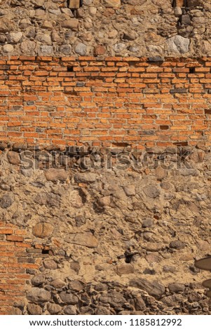 Background for design texture of stone and brick walls and doors of old houses or castles
