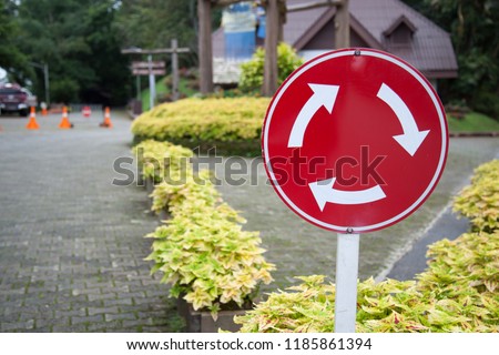 Metal Plate, Traffic Sign: Mini-roundabout (roundabout circulation - give way to vehicles from the immediate right)
Three arrows forming a clockwise circle within a red circle